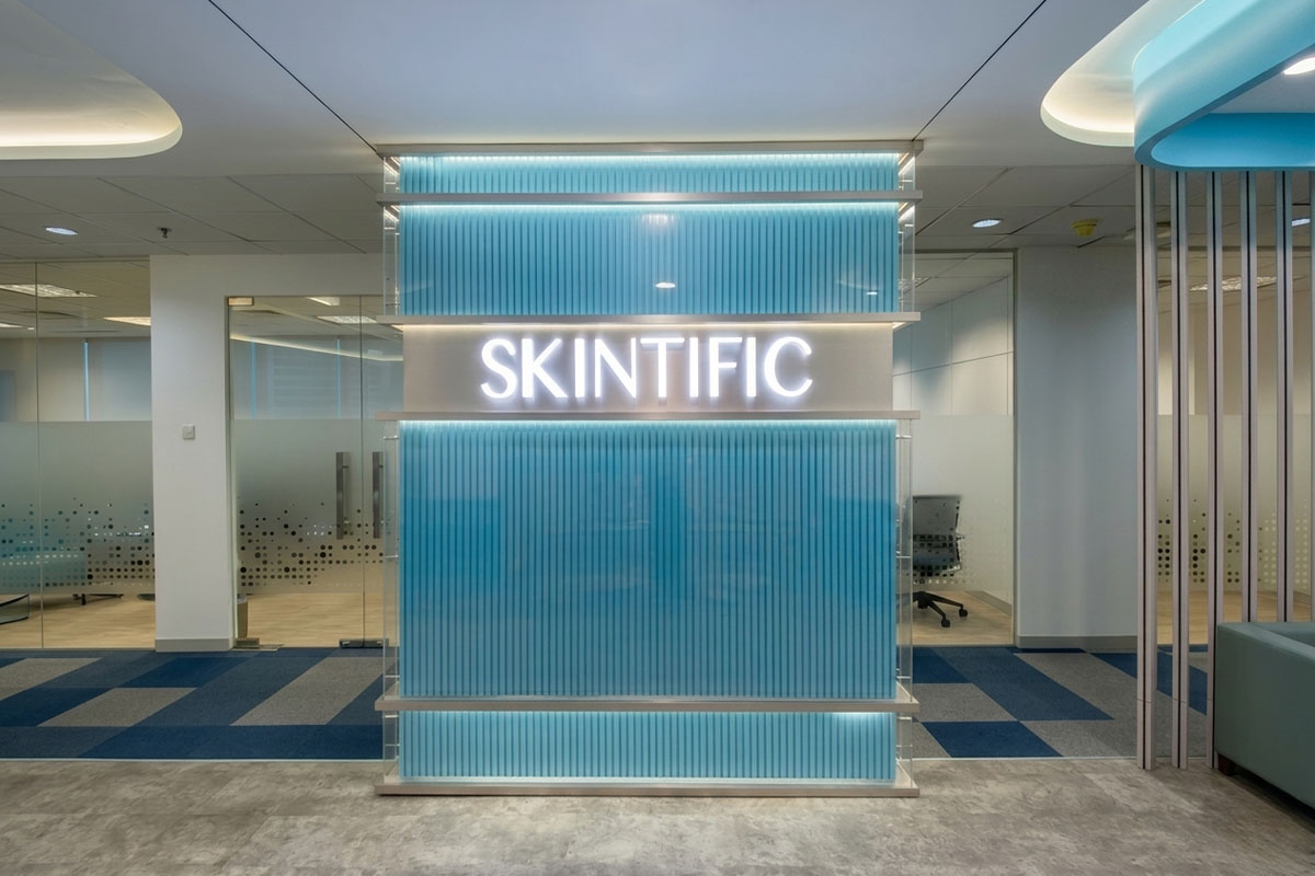 Skintific — brand backdrop feature wall at reception